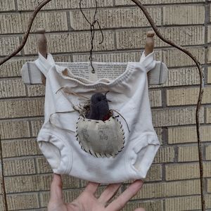 a little robin nest wall hanging